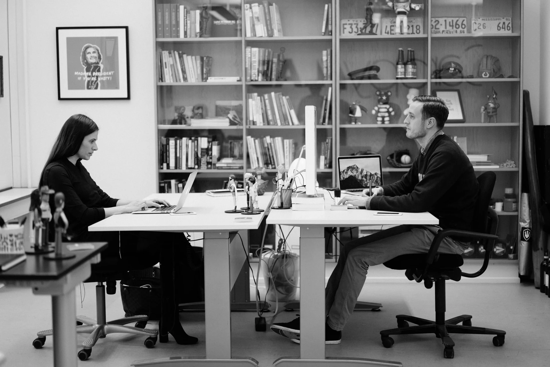 Sahra-Josephine and a colleague working at facing desks