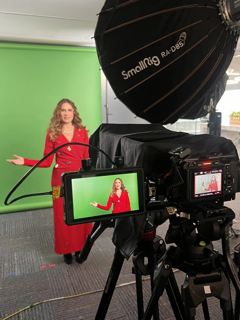 Sahra-Josephine filming in front of a green screen