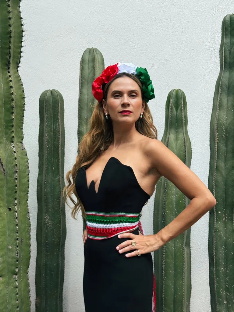 Sahra-Josephine with a flower crown in front of cacti
